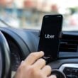 Apple iPhone 14 with application Taxi Uber in the screen. iPhone 14 was created and developed by the Apple inc.