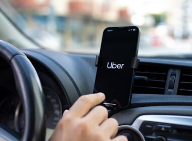 Apple iPhone 14 with application Taxi Uber in the screen. iPhone 14 was created and developed by the Apple inc.